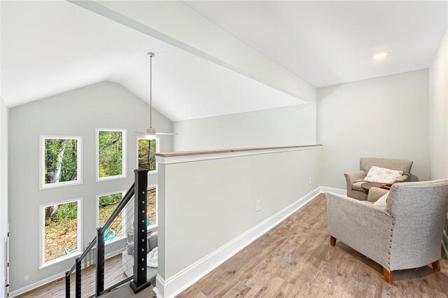 sitting room with lofted ceiling, ceiling fan, and wood-type flooring