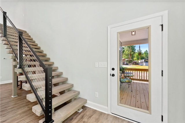 doorway with wood-type flooring