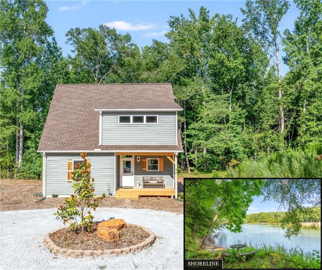 view of property featuring a water view and covered porch