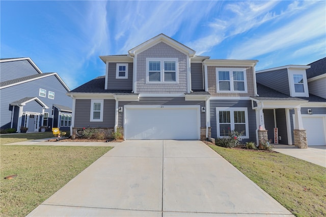 view of front facade featuring a garage and a front yard