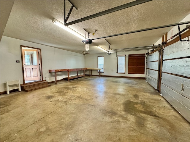 garage with ceiling fan and a garage door opener