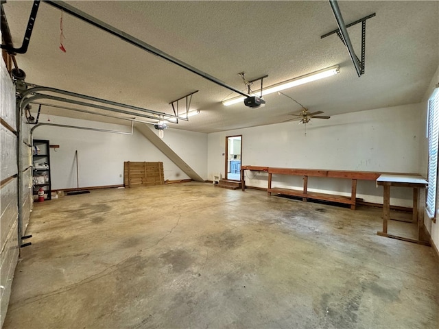 garage featuring a garage door opener and ceiling fan