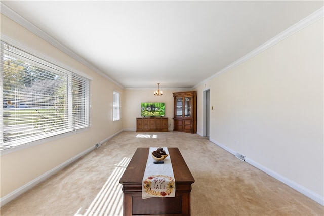 unfurnished dining area featuring ornamental molding, light colored carpet, and a notable chandelier