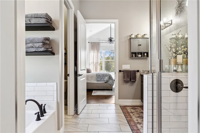 bathroom with plus walk in shower, hardwood / wood-style floors, and ceiling fan