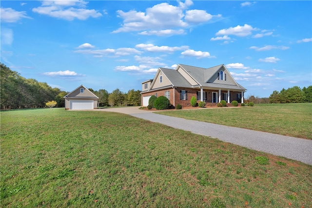 view of front of house with a front yard and a garage