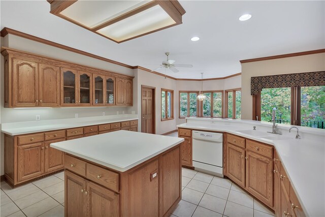 kitchen with ceiling fan, dishwasher, sink, crown molding, and light tile patterned floors