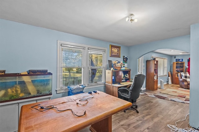 office space with light wood-type flooring