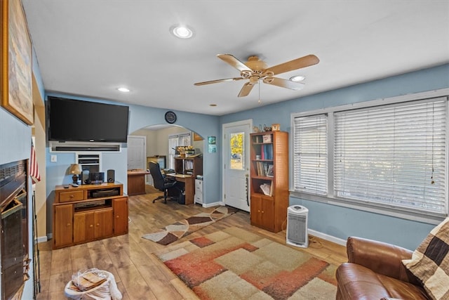 interior space with ceiling fan and light hardwood / wood-style floors