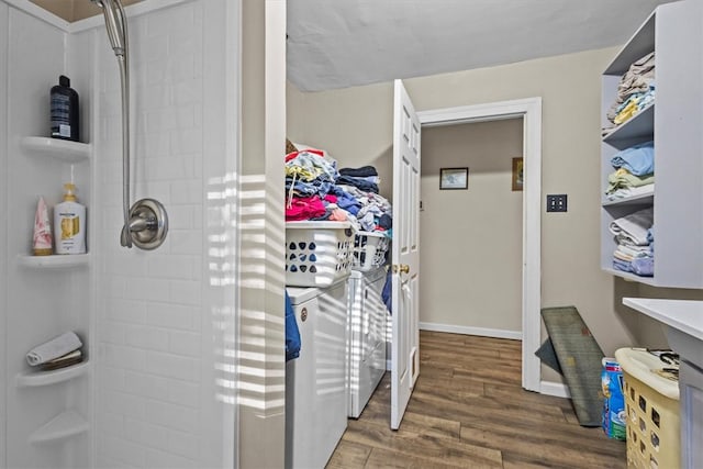 bathroom featuring walk in shower and hardwood / wood-style flooring