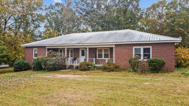 ranch-style house featuring a front yard and a porch