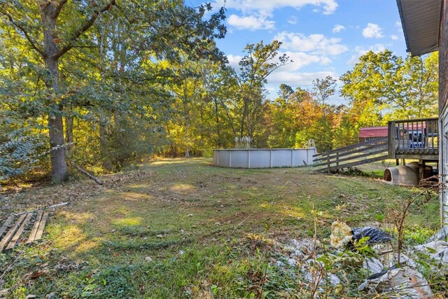 view of yard featuring a pool side deck