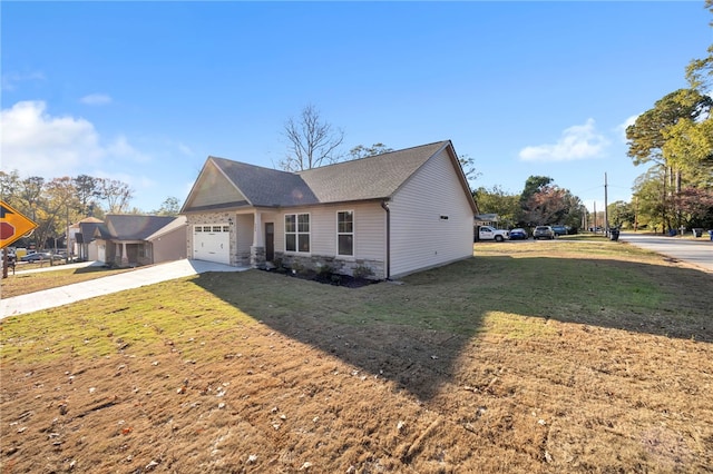 view of front facade with a garage and a front lawn