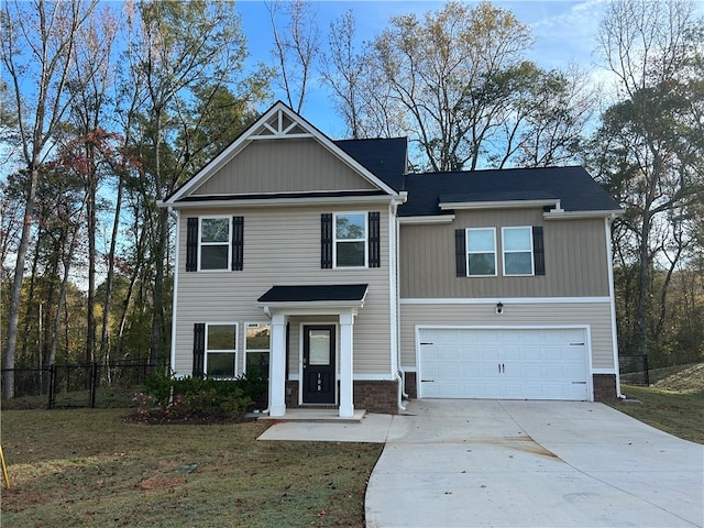 view of front of home featuring a front lawn and a garage