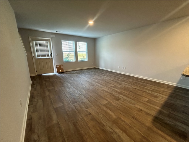 interior space with dark hardwood / wood-style flooring