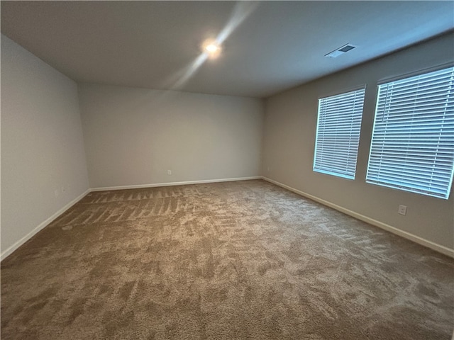 view of carpeted spare room