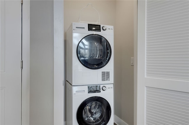 washroom with stacked washer and clothes dryer