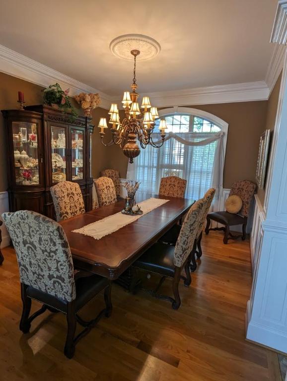 121 Turnberry Rd, Anderson, SC 29626 - dining area with hardwood / wood-style flooring, crown molding, and a notable chandelier