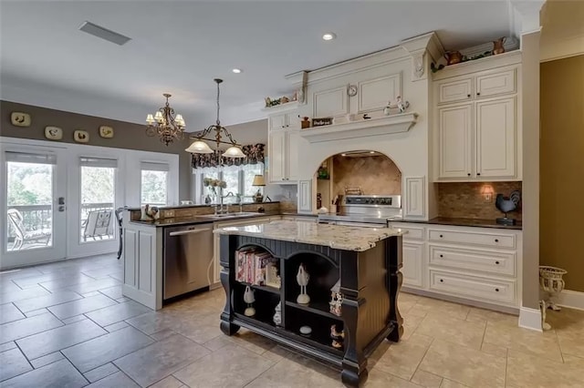 121 Turnberry Rd, Anderson, SC 29626 - kitchen with a kitchen island, kitchen peninsula, stainless steel appliances, and dark stone counters