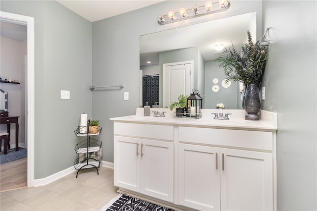 bathroom featuring tile patterned flooring, vanity, and a shower with shower curtain