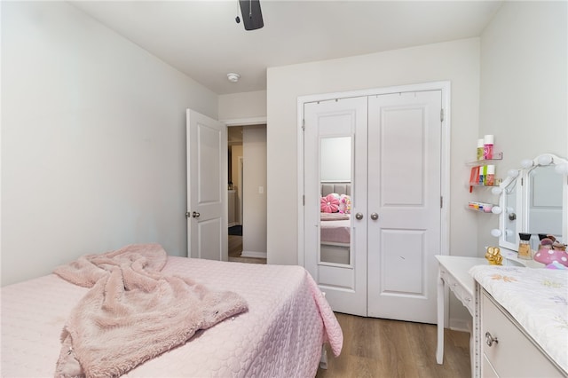 bedroom featuring a closet, ceiling fan, and light hardwood / wood-style flooring