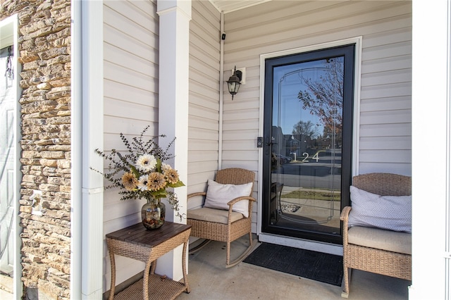 property entrance featuring a porch