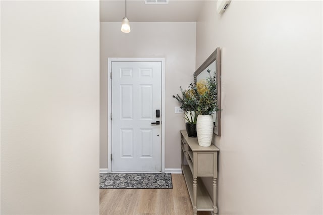 doorway to outside featuring light hardwood / wood-style floors