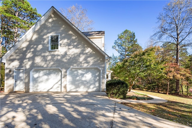 view of side of home featuring a garage