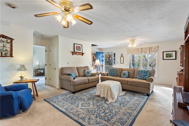 carpeted living room with ceiling fan, crown molding, and a textured ceiling