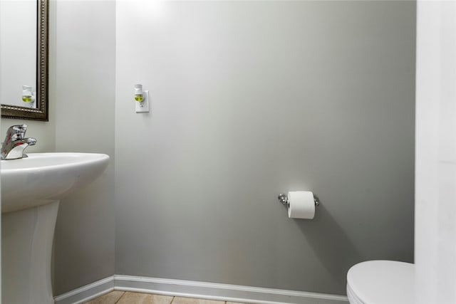 bathroom featuring tile patterned floors and toilet