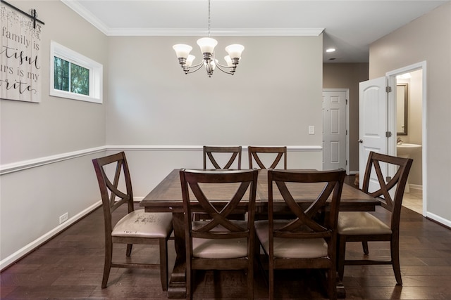 dining space with dark hardwood / wood-style flooring, crown molding, and an inviting chandelier