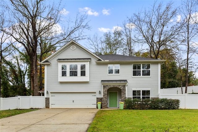 split foyer home with a garage and a front yard