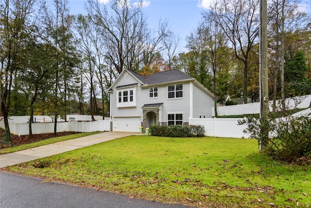 view of front of house featuring a front yard and a garage