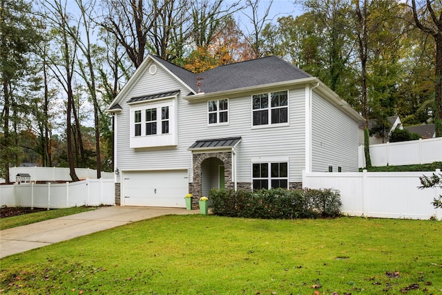 view of front of house featuring a garage and a front lawn