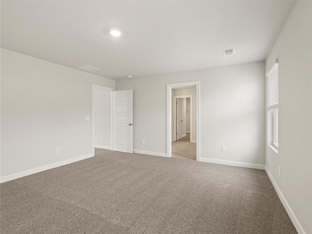 unfurnished room featuring carpet flooring