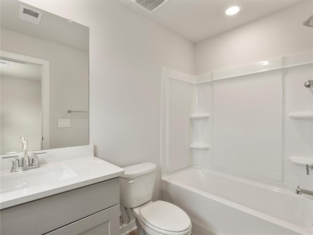 full bathroom with shower / tub combination, vanity, and toilet