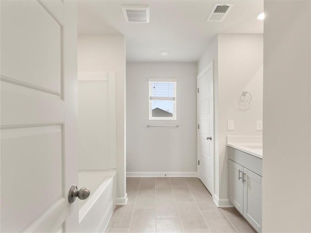 bathroom with vanity and tile patterned floors