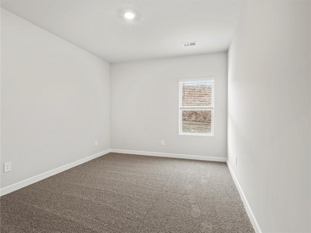 empty room featuring carpet flooring