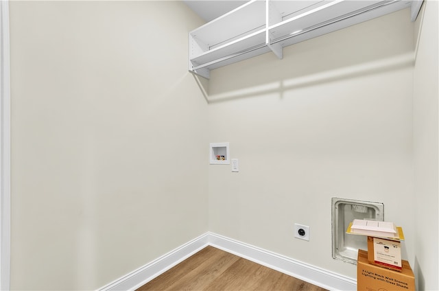 washroom featuring washer hookup, hardwood / wood-style flooring, and electric dryer hookup