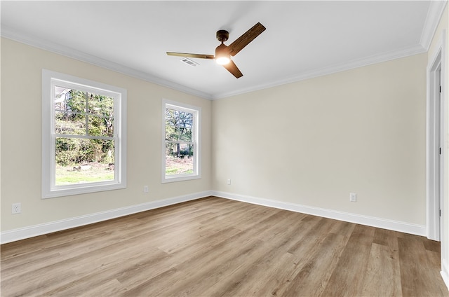 spare room with ceiling fan, light wood-type flooring, and crown molding