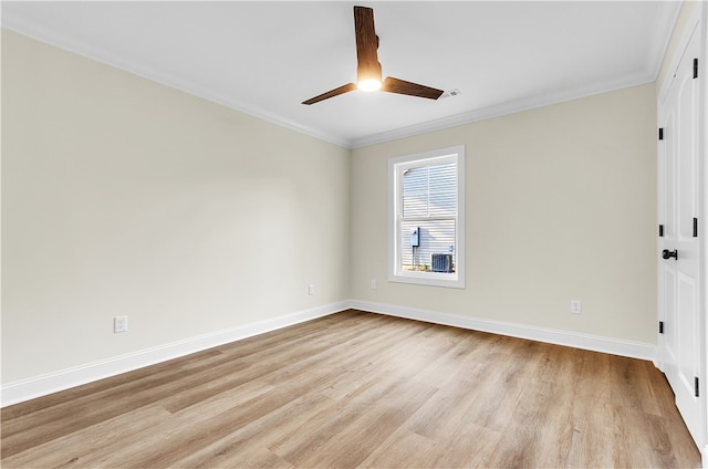 empty room featuring ceiling fan, light hardwood / wood-style floors, and ornamental molding