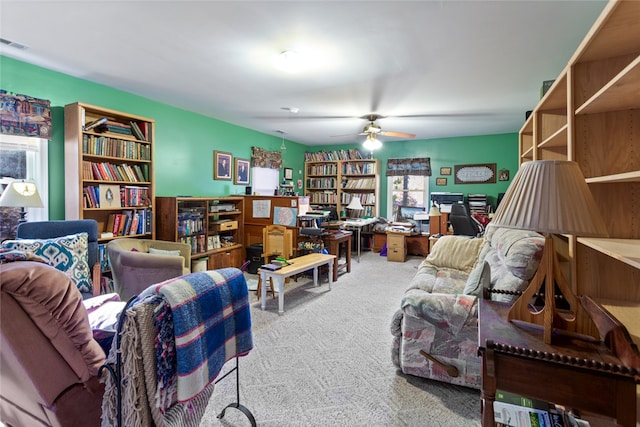 office space with carpet, a wealth of natural light, and ceiling fan