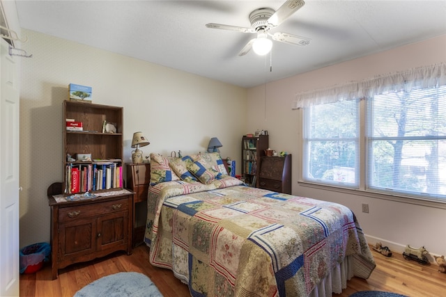 bedroom featuring ceiling fan and wood-type flooring