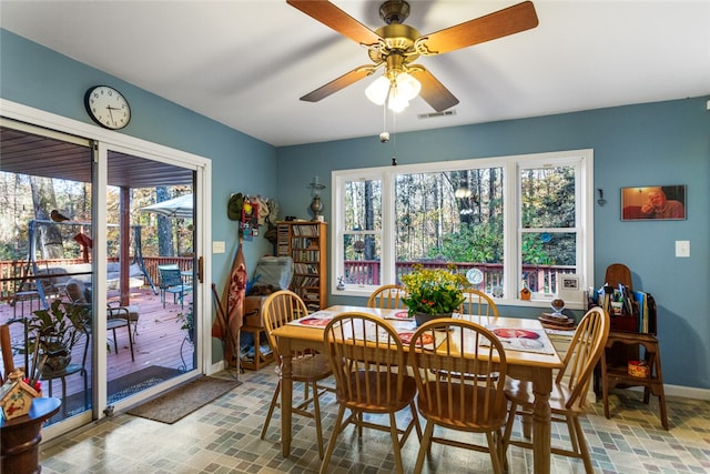 dining area featuring ceiling fan and a healthy amount of sunlight