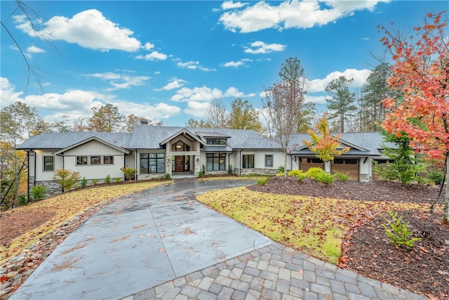 single story home featuring a garage