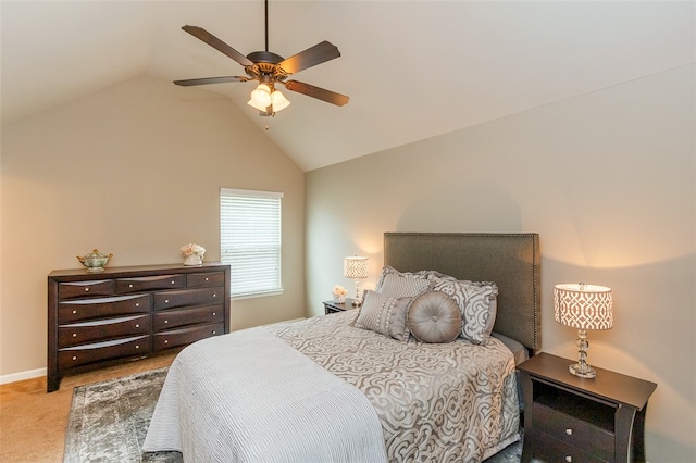 bedroom featuring ceiling fan, light colored carpet, and vaulted ceiling