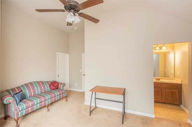 sitting room featuring light colored carpet, high vaulted ceiling, ceiling fan, and sink