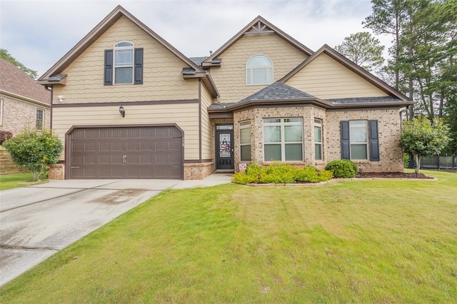 view of front facade featuring a front yard and a garage