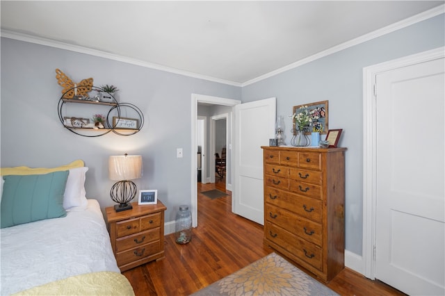 bedroom featuring dark hardwood / wood-style flooring and ornamental molding