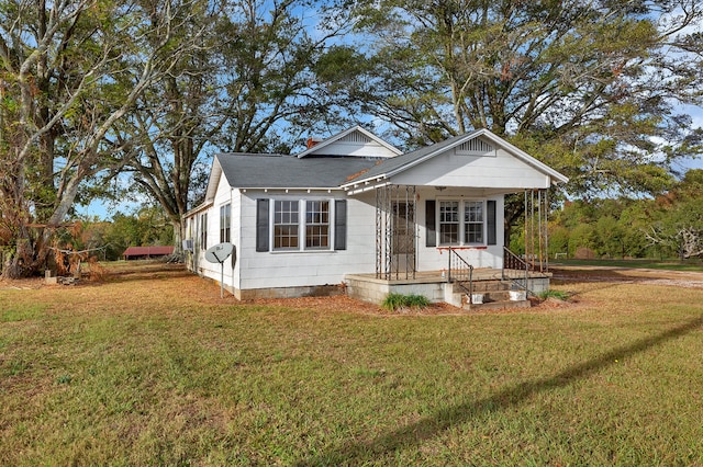 bungalow featuring a porch and a front yard