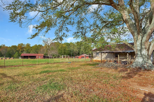 view of yard with a rural view